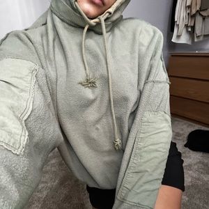 Very unique hoodie with an inside-out style and stitching.